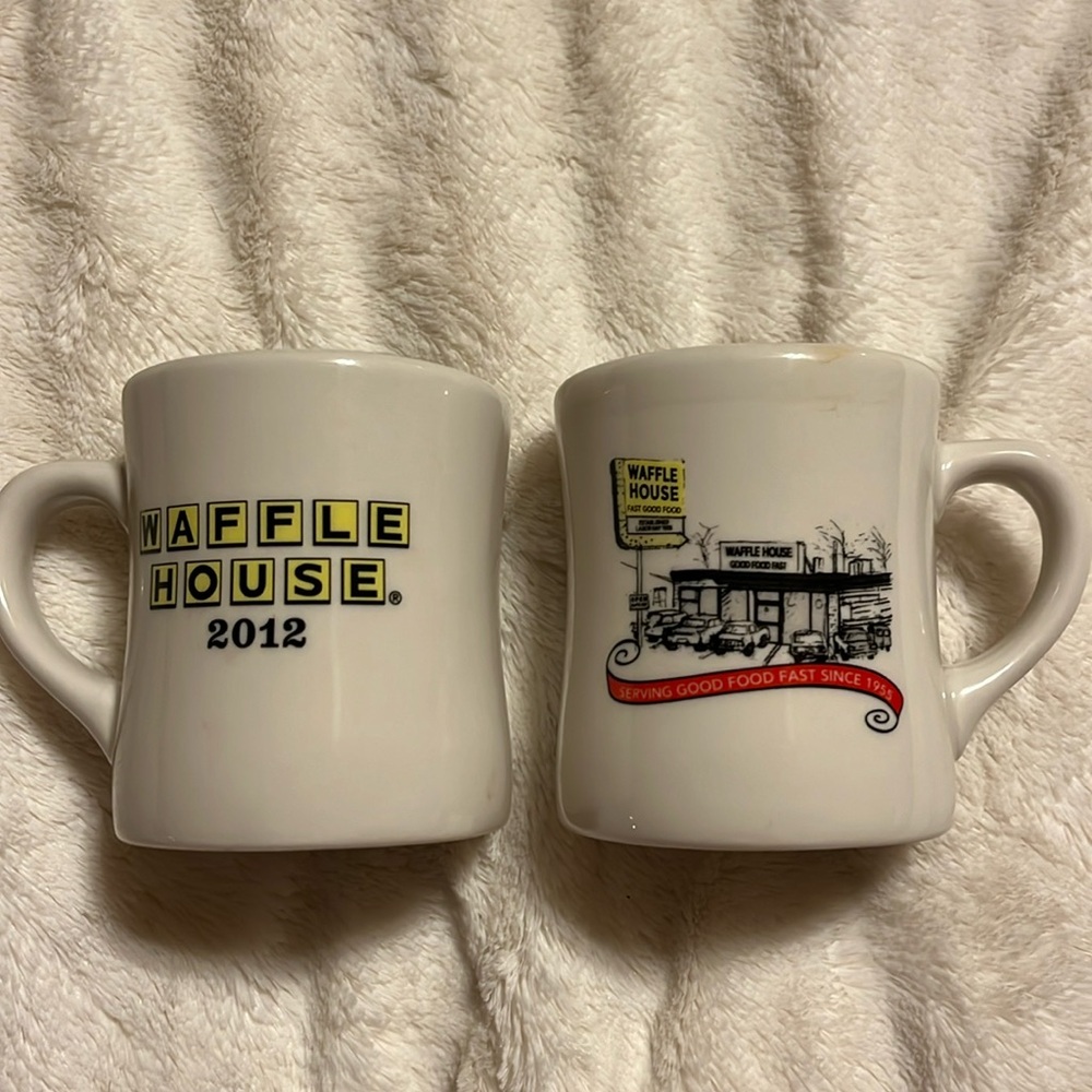 Set of two commemorative Waffle House mugs.